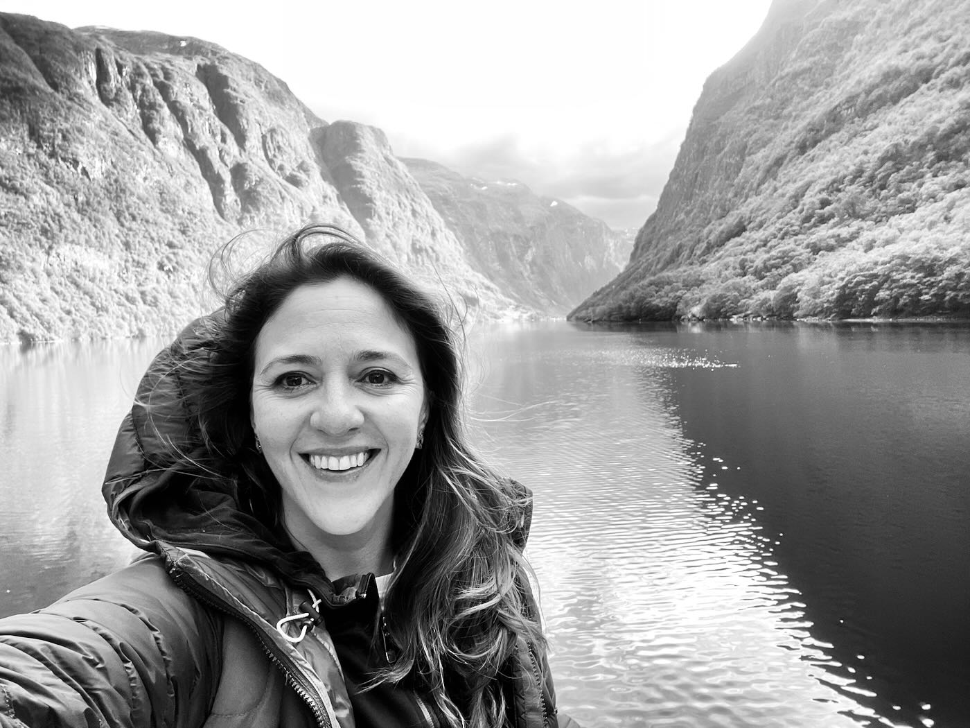 Marcela Campuzano in front of a Norwegian fjord.